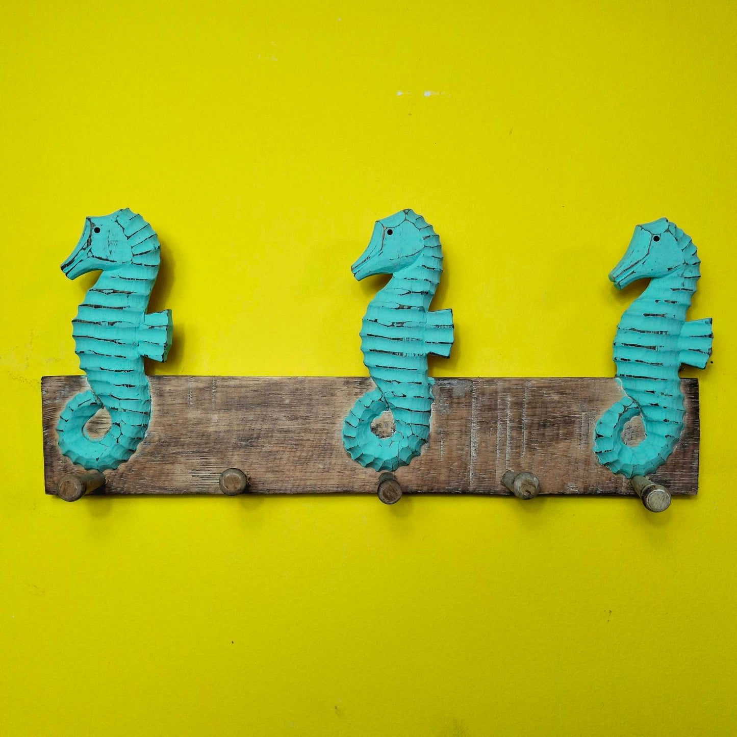 Ethnic seahorse coat hanger
