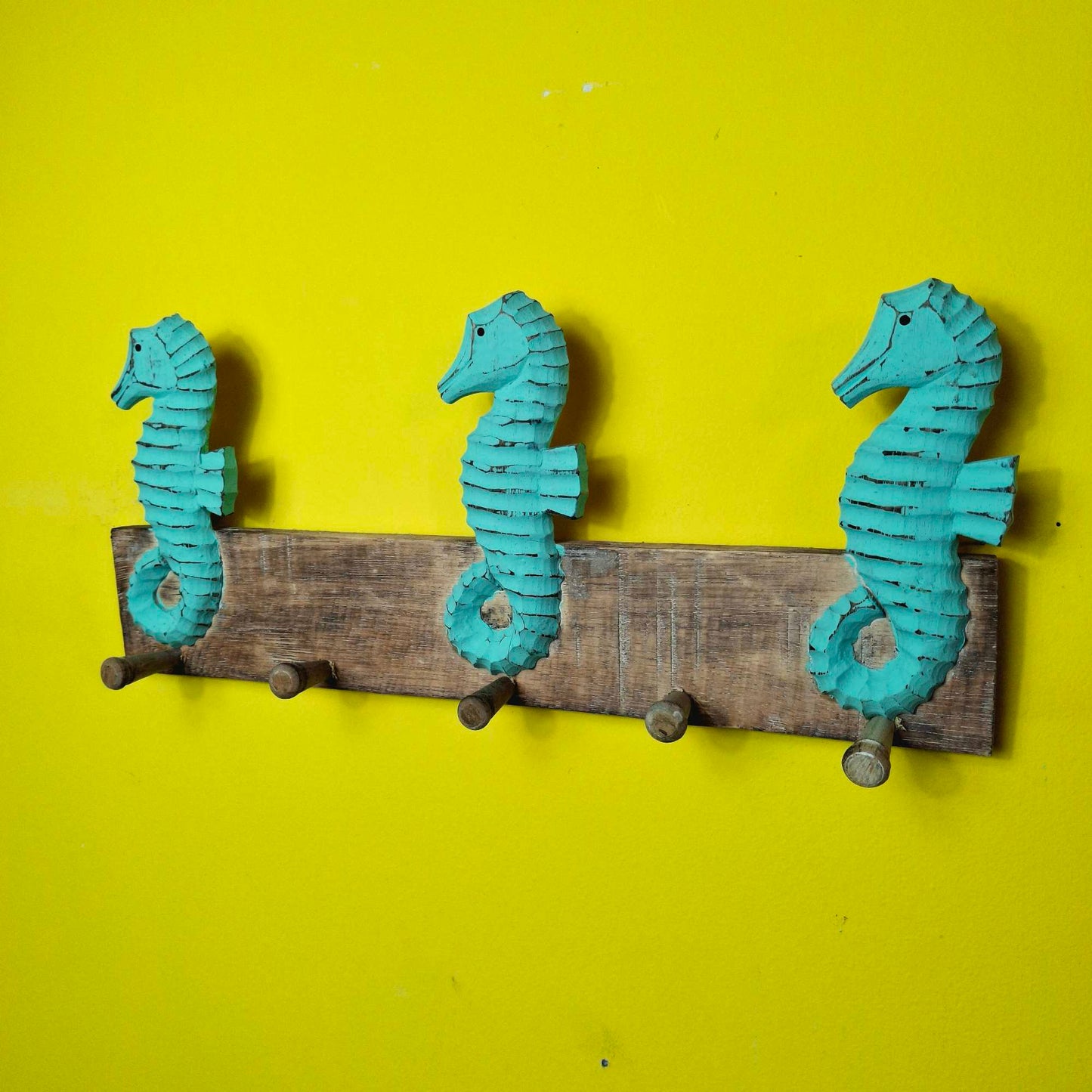 Ethnic seahorse coat hanger