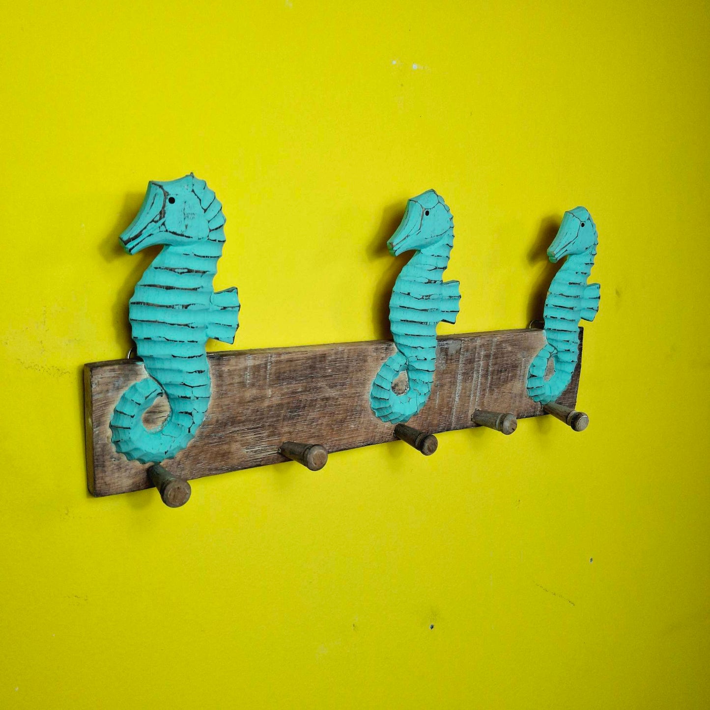 Ethnic seahorse coat hanger