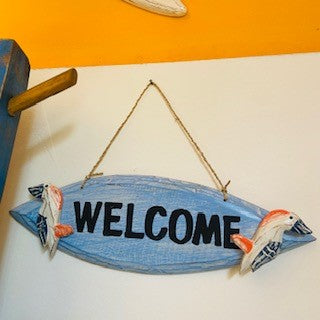 Decorative wooden welcome sign with pelican