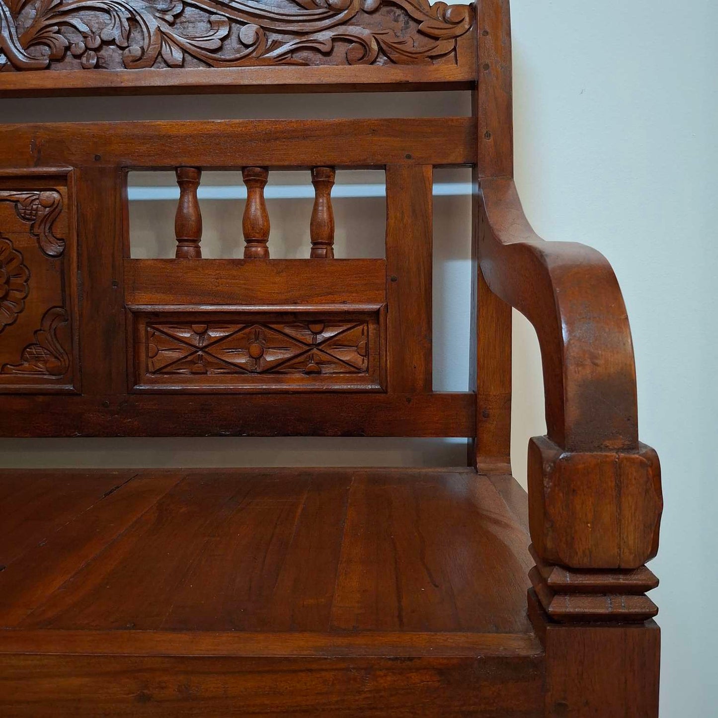 Ethnic sofa armchair with floral carvings