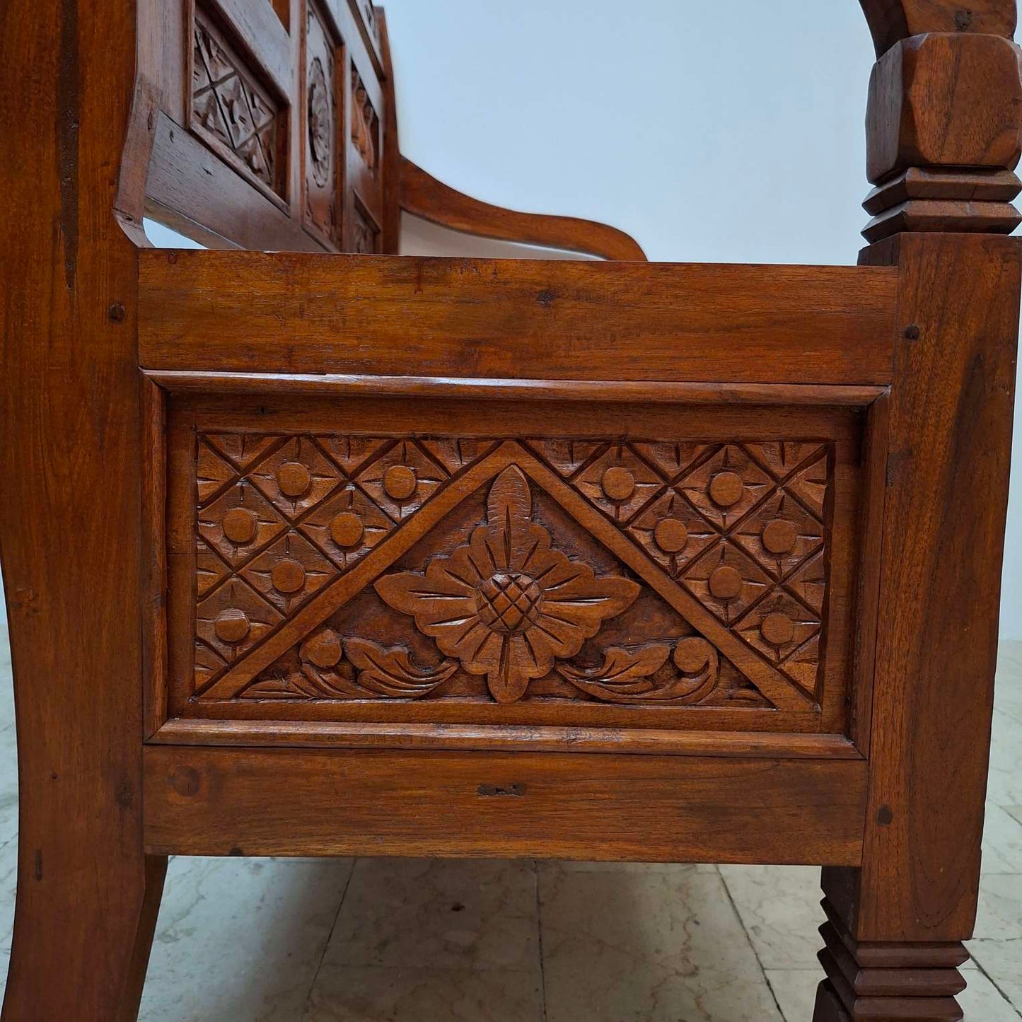 Ethnic sofa armchair with floral carvings