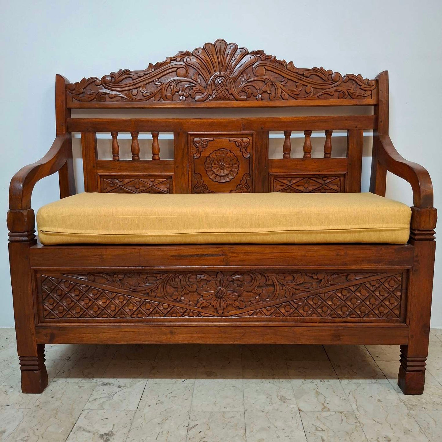 Ethnic sofa armchair with floral carvings