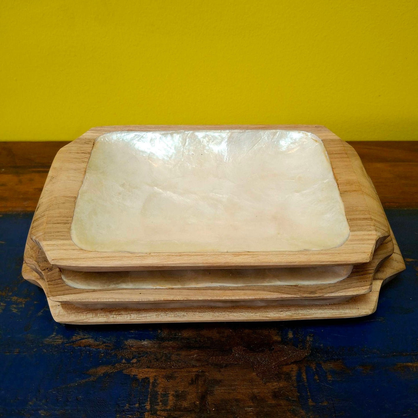 Set of wooden and mother of pearl trays to empty pockets