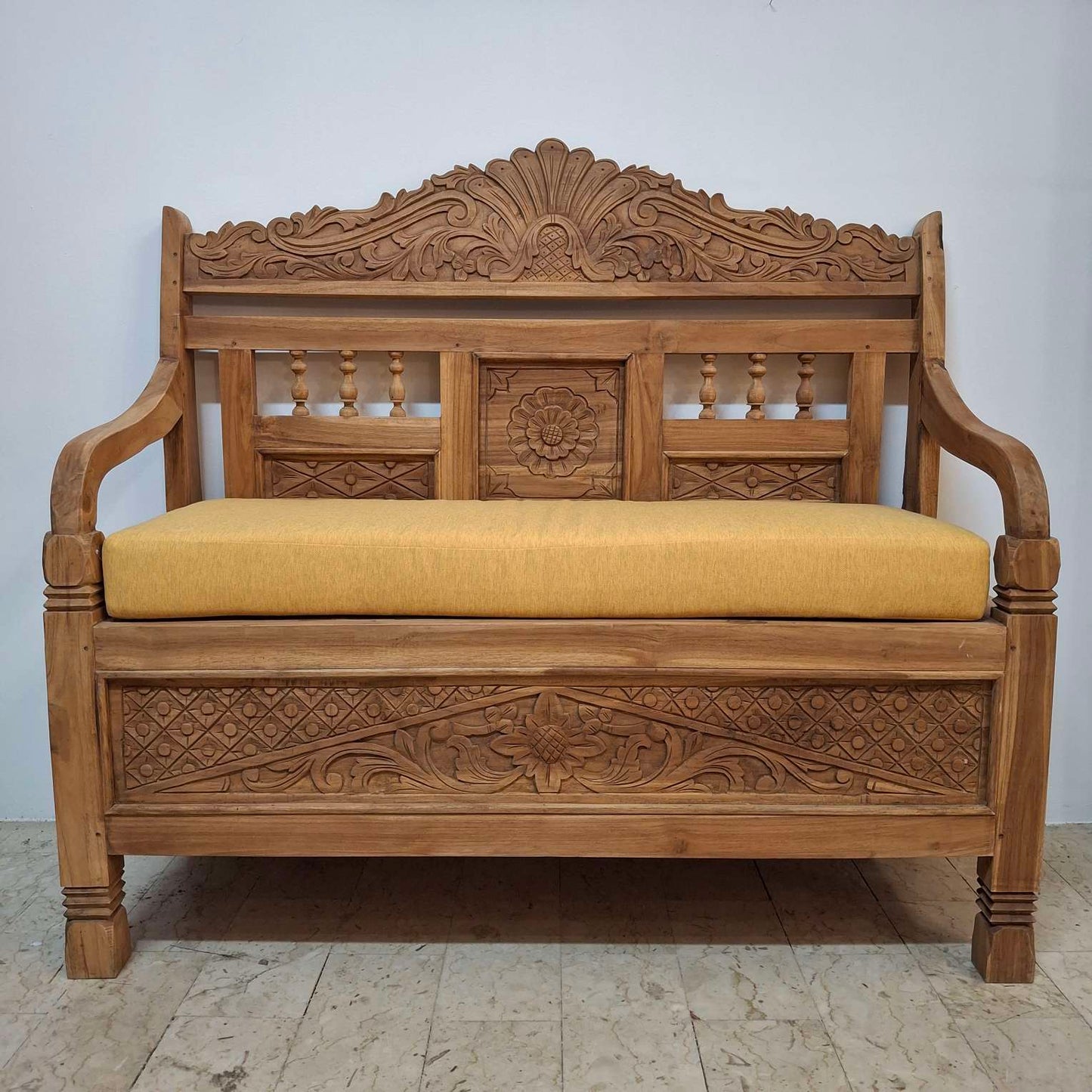 Container sofa with floral carvings