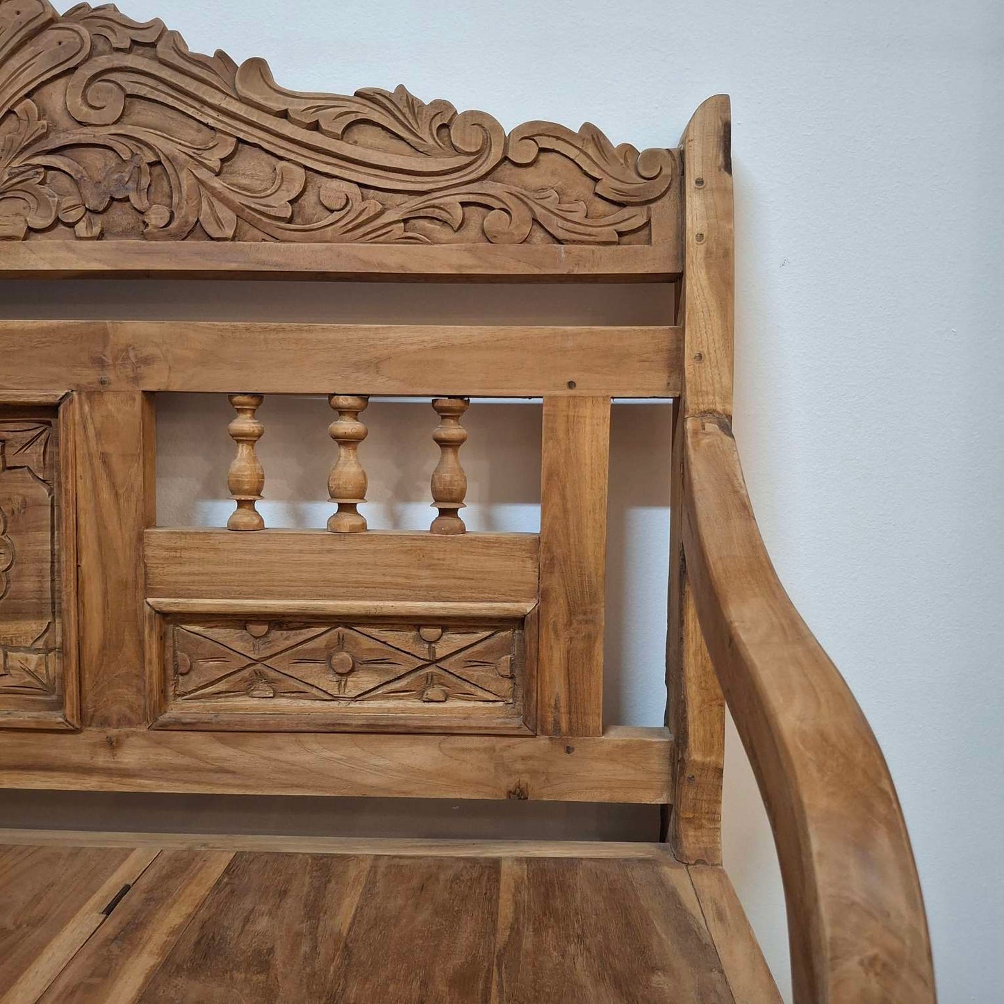 Container sofa with floral carvings