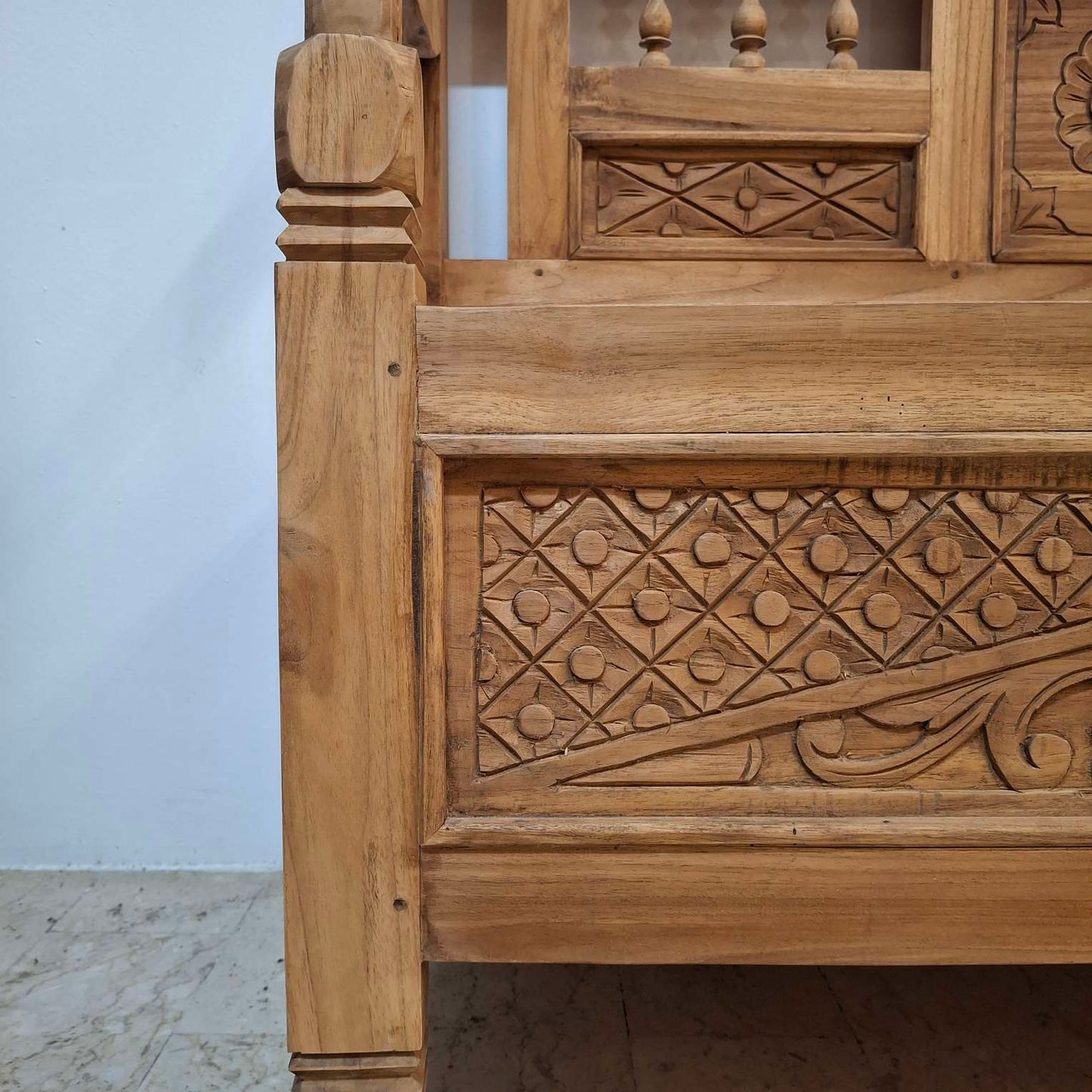 Container sofa with floral carvings