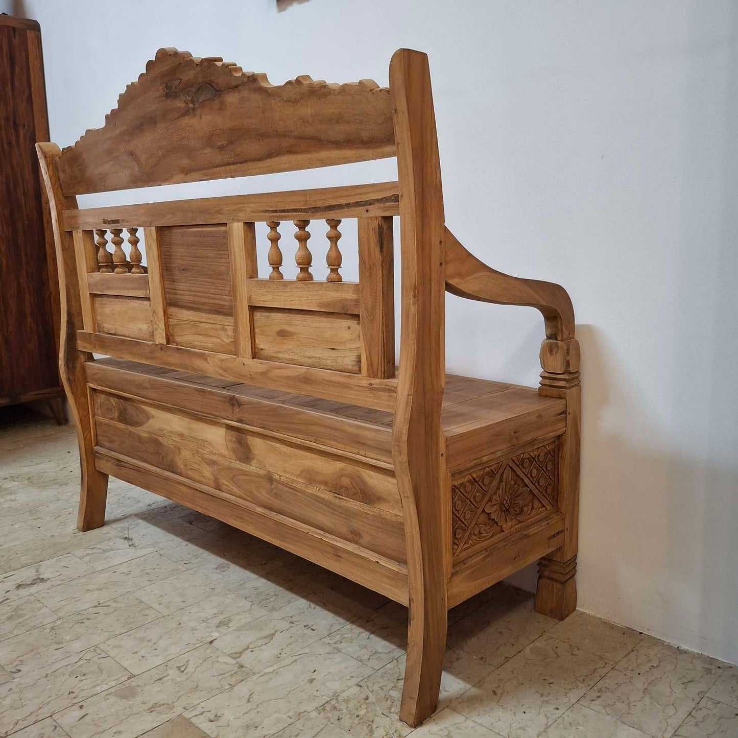 Container sofa with floral carvings