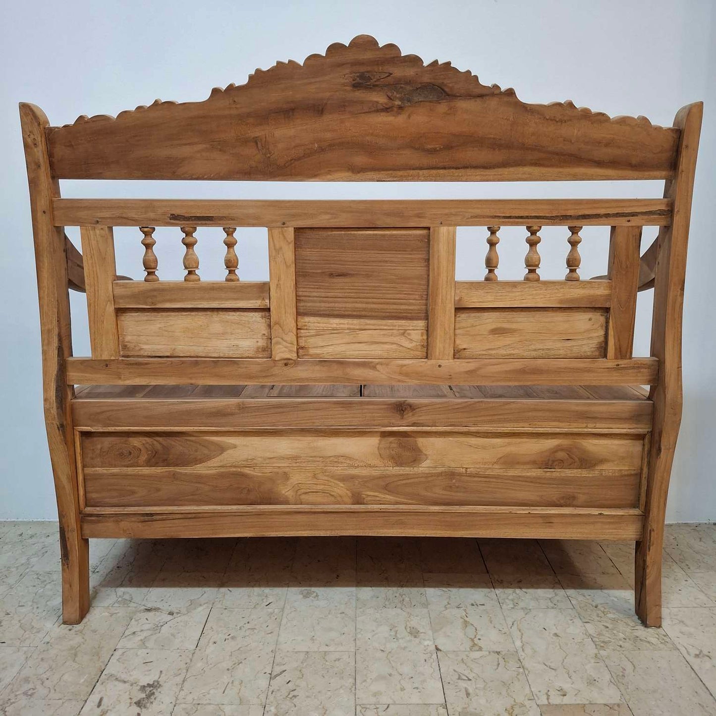 Container sofa with floral carvings