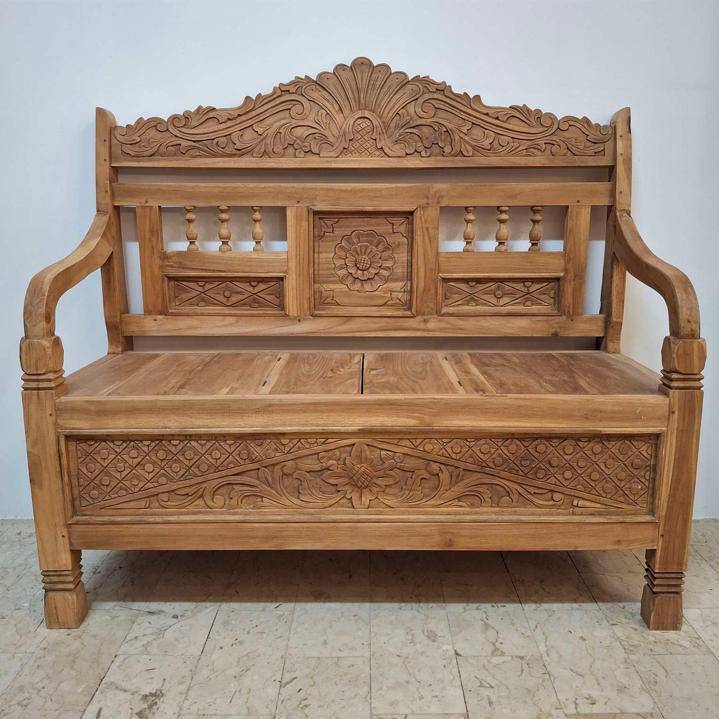 Container sofa with floral carvings