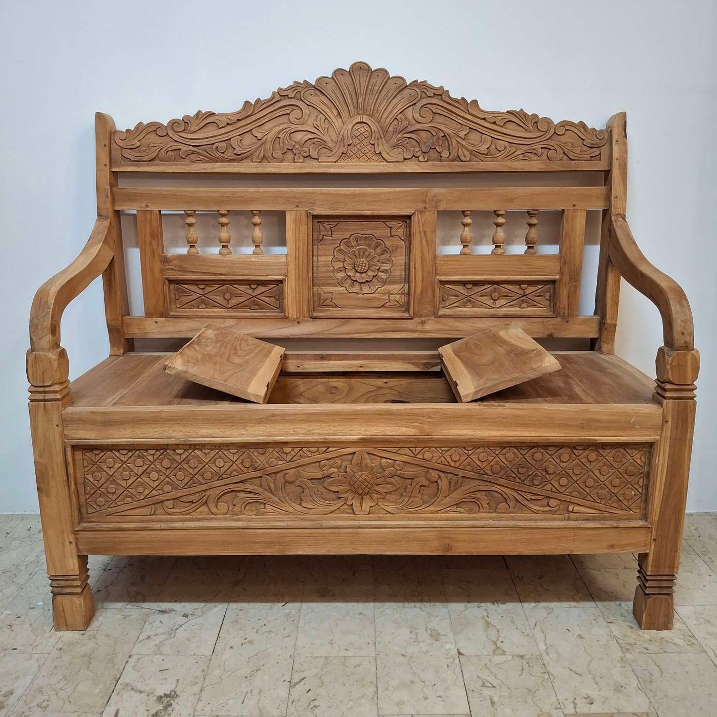 Container sofa with floral carvings