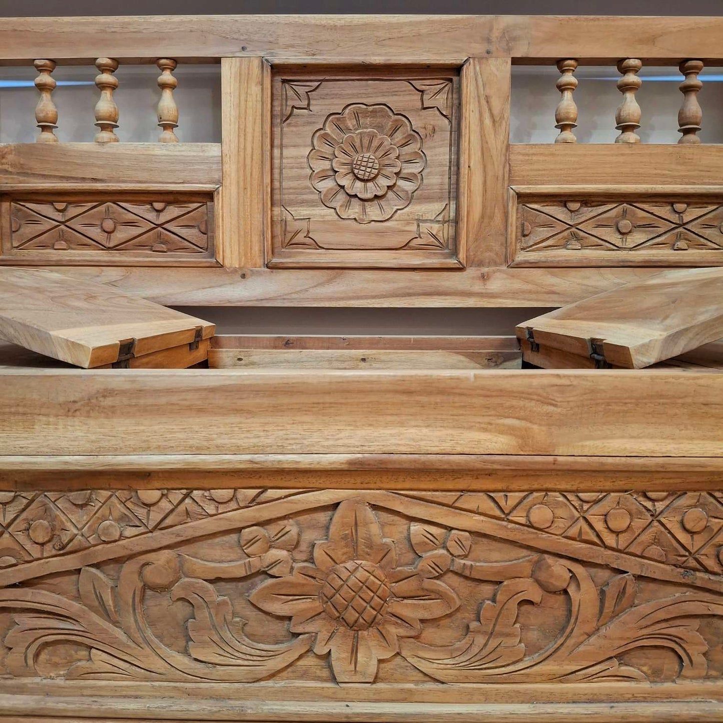 Container sofa with floral carvings