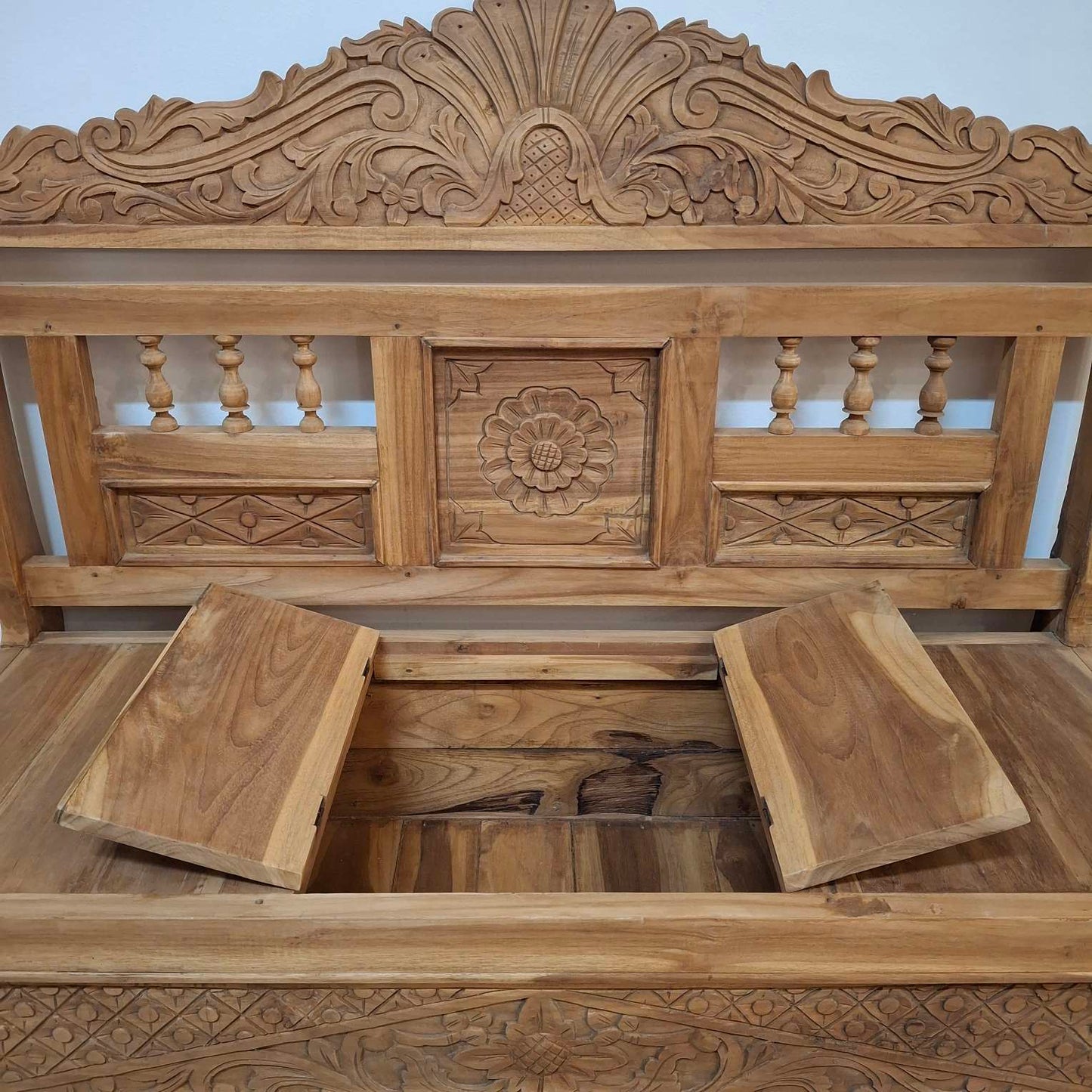 Container sofa with floral carvings