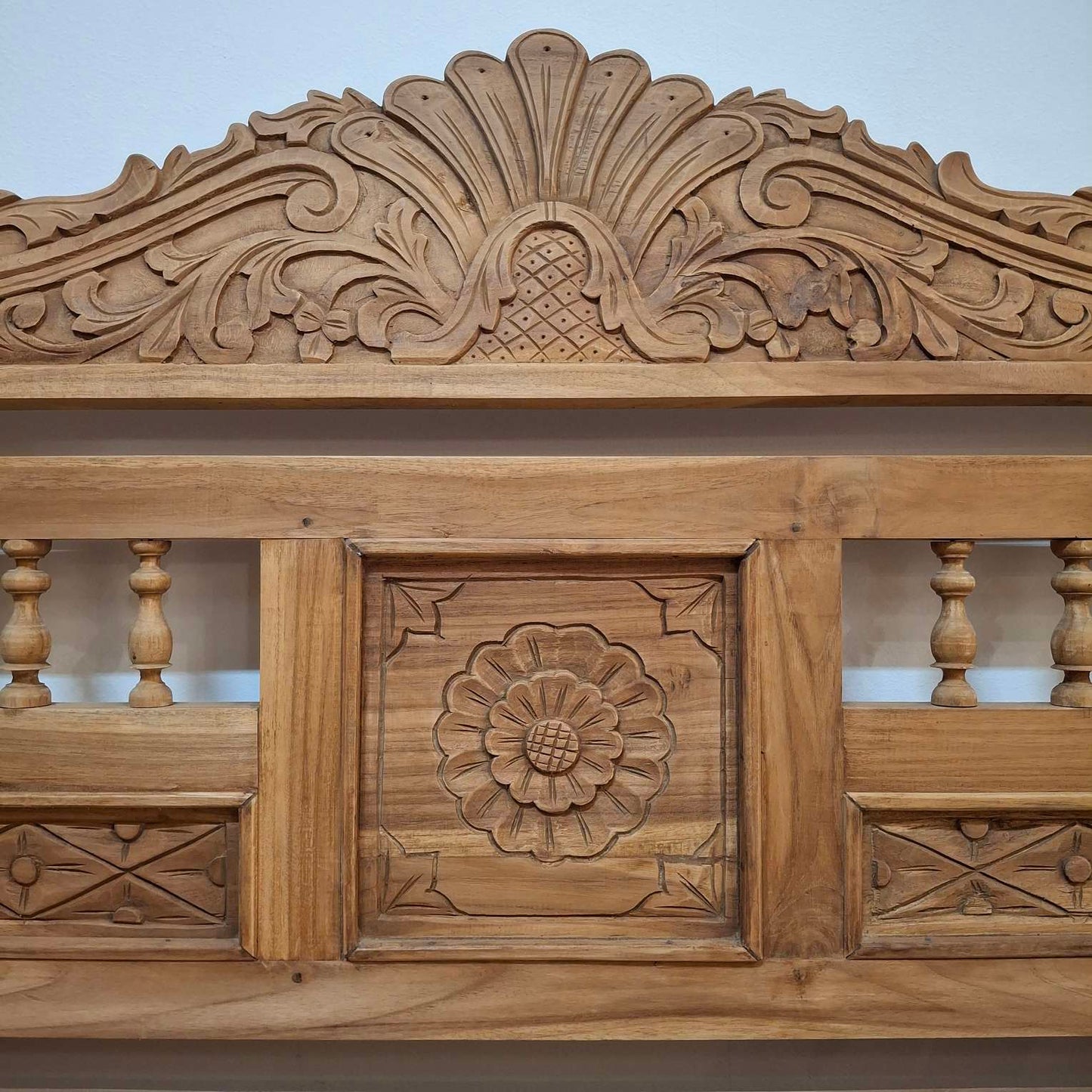 Container sofa with floral carvings