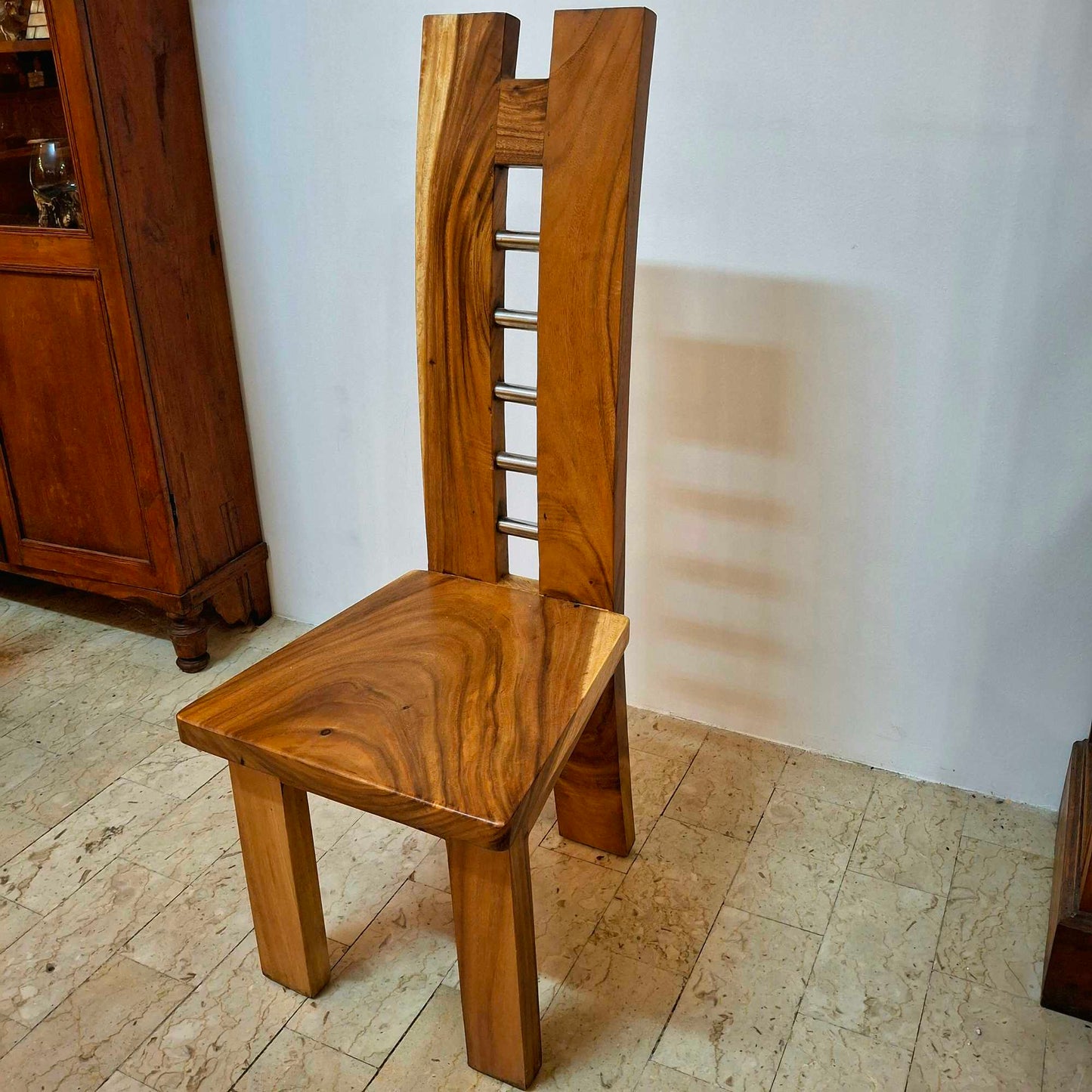 Chair made of a whole slice of solid Suar wood