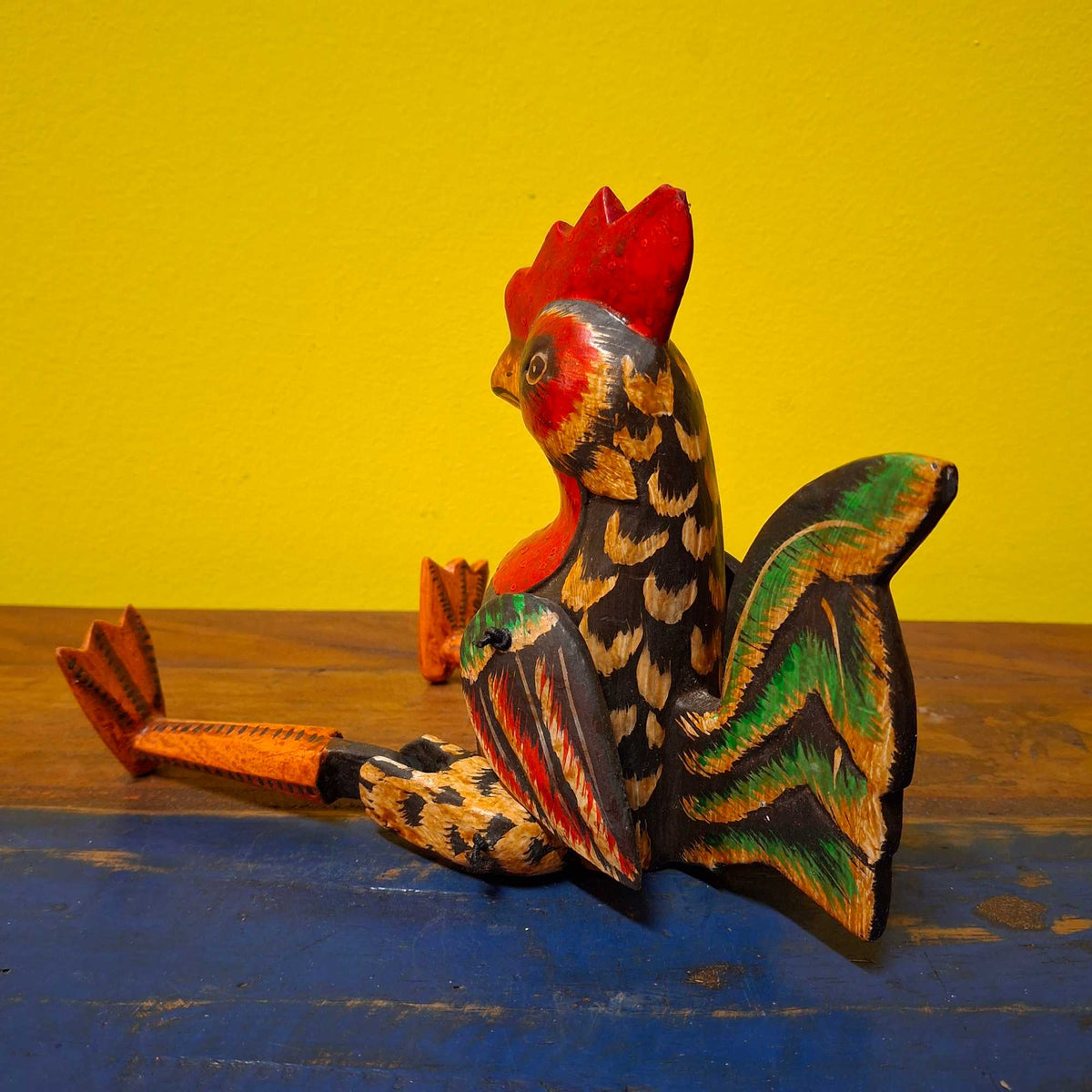Statuetta burattino in legno gallo decorativo
