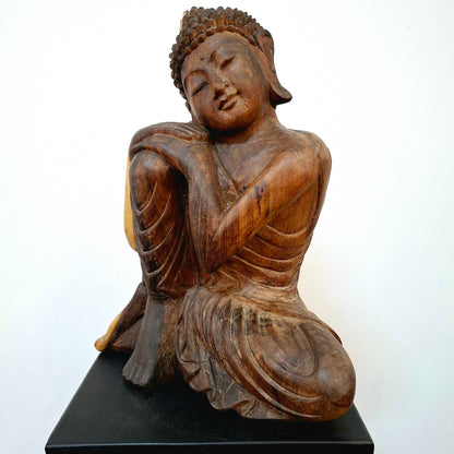 Wooden statuette suar sculpture sleeping Buddha