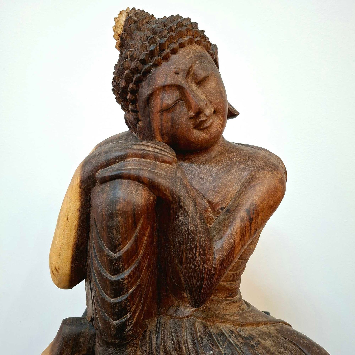 Wooden statuette suar sculpture sleeping Buddha