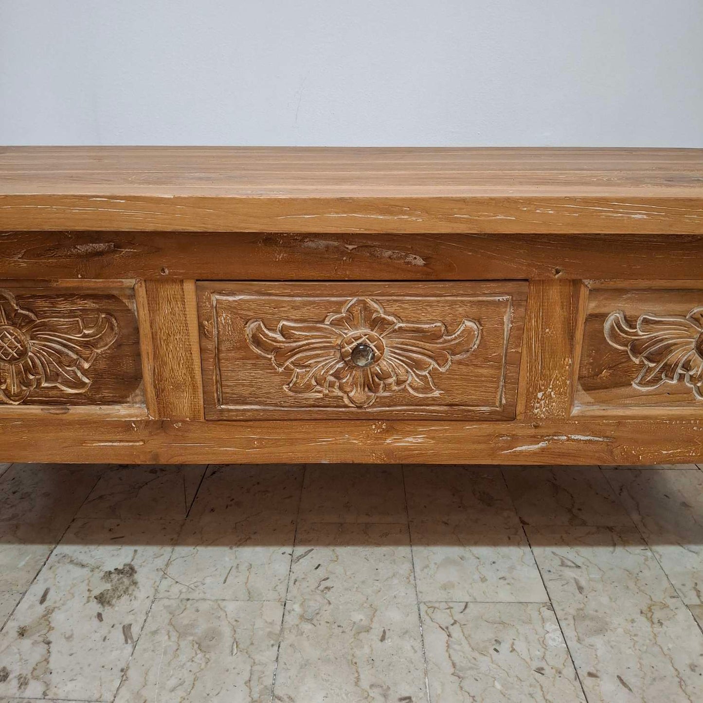 Teak wood coffee table with floral carvings
