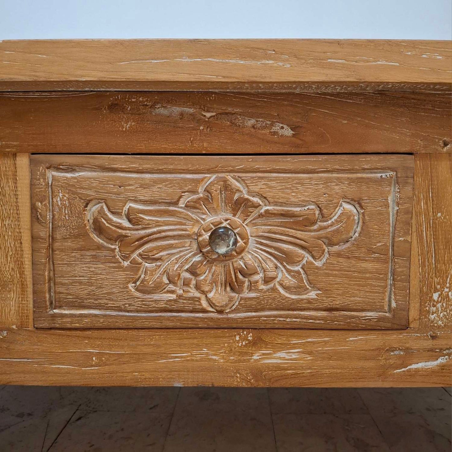 Teak wood coffee table with floral carvings