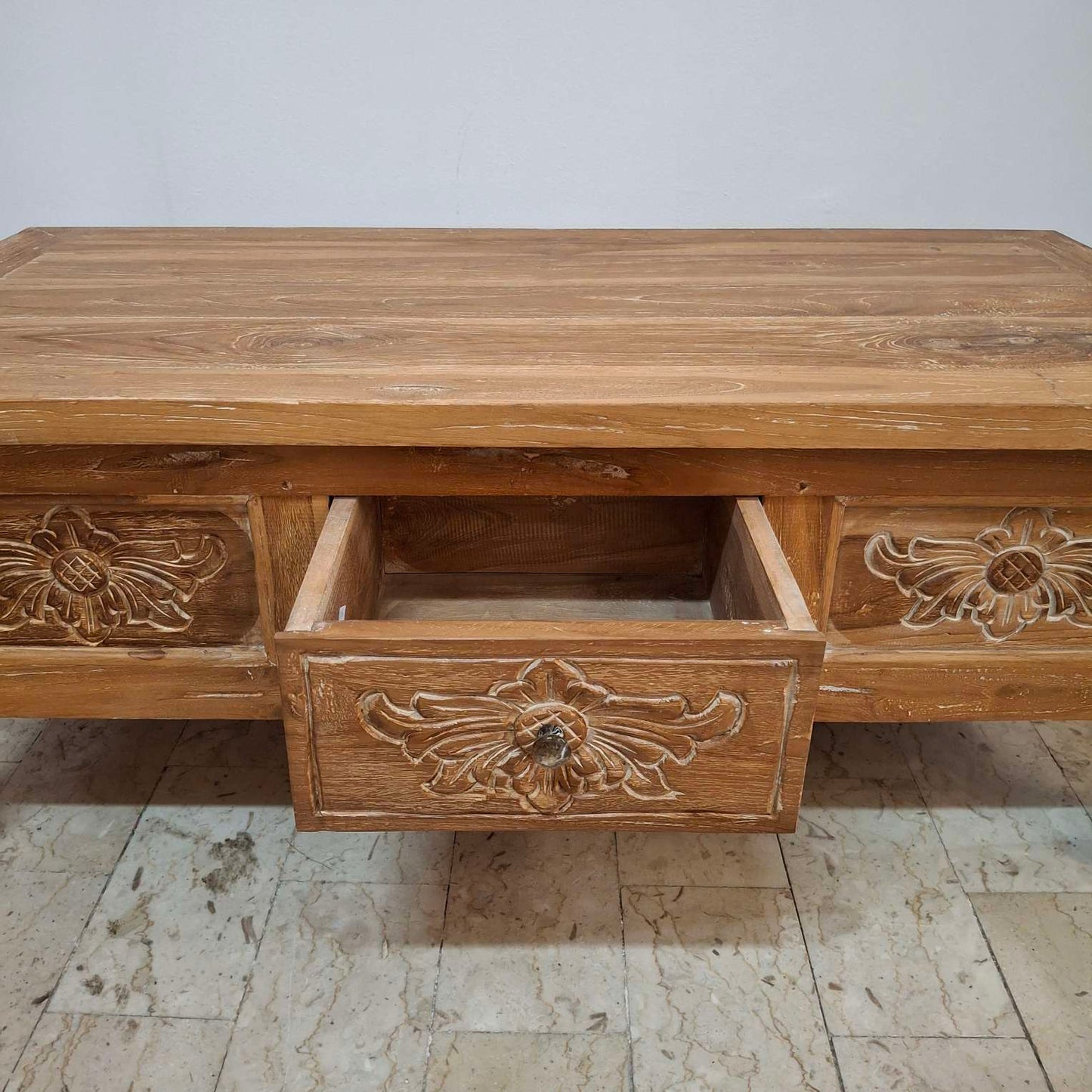 Teak wood coffee table with floral carvings