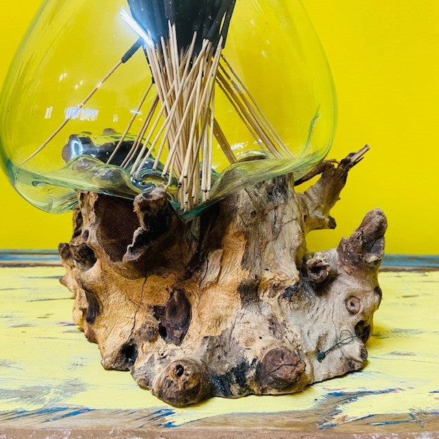 Fused glass vase on root ethnic decor