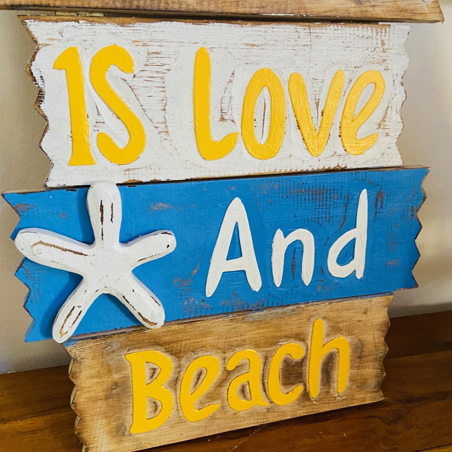 Ethnic wooden frame deco sign love and beach